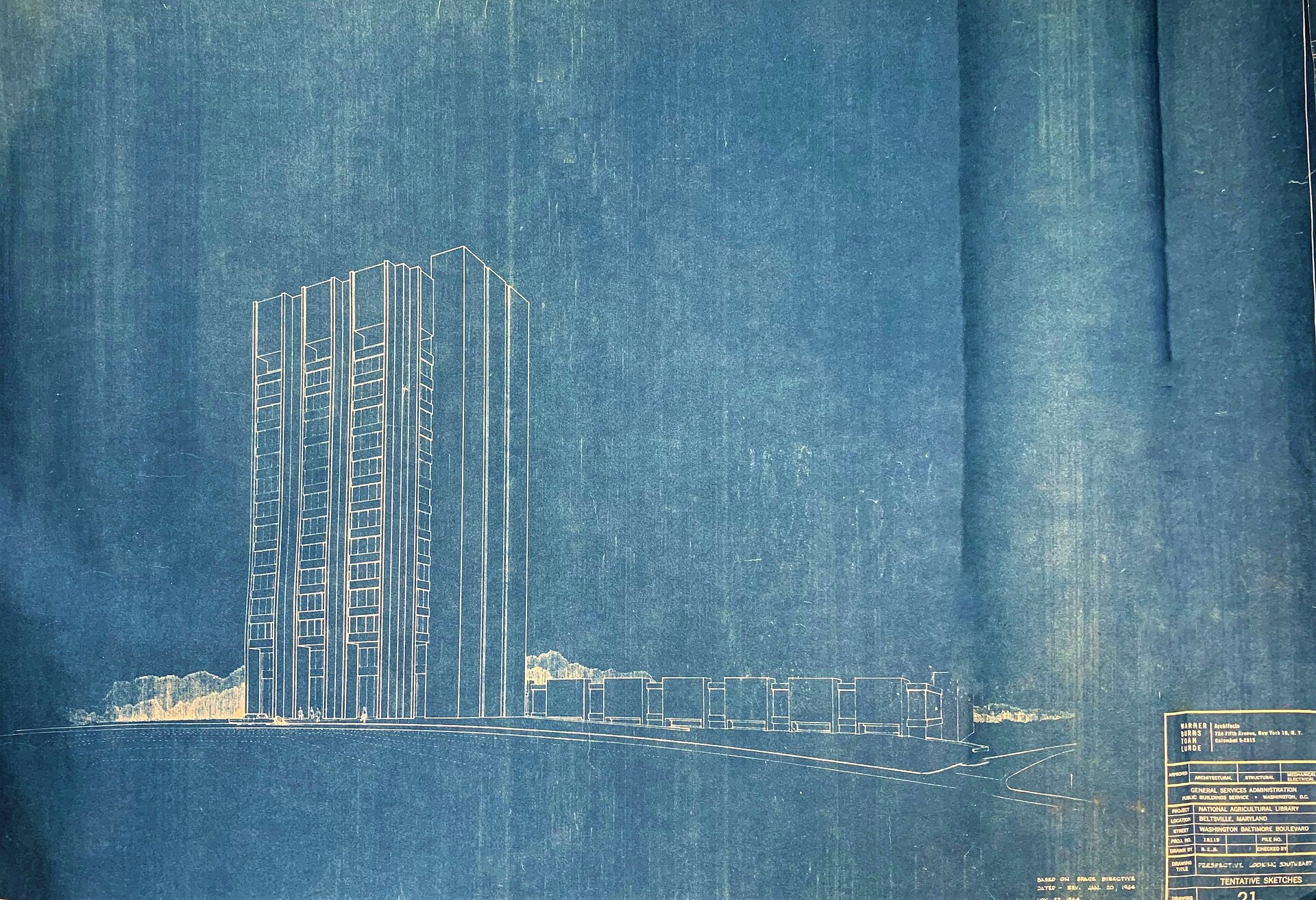 An architectural blueprint of a tall office tower, white lines on faded blue paper.